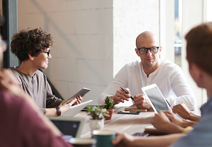 Managed IT consultants holding a meeting